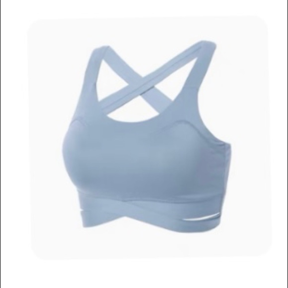 BRAND NEW Sports bra in light blue, never worn